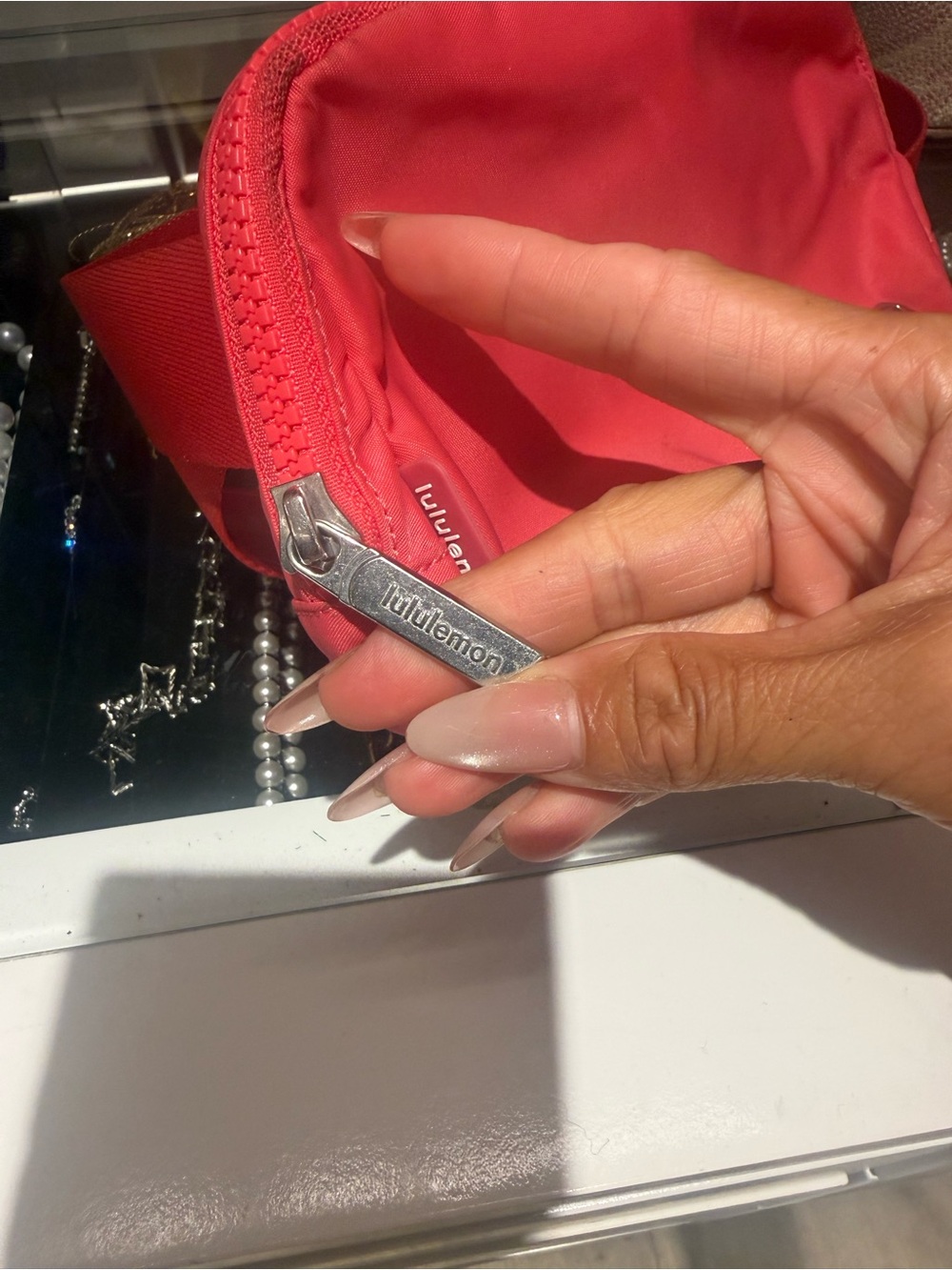 Subcategory selection for red Lululemon pouch